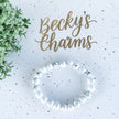 White and blue marbled gemstone bracelet for spiritual healing and chakra balance, styled with greenery and gold text