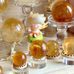 Golden citrine crystal spheres with angel figurine, healing stones for positivity and spiritual growth