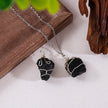 Handmade black crystal necklace with wire-wrapped raw stones, perfect for protection and spiritual healing.