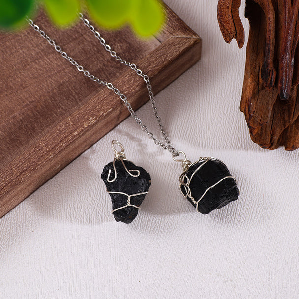 Handmade black crystal necklace with wire-wrapped raw stones, perfect for protection and spiritual healing.