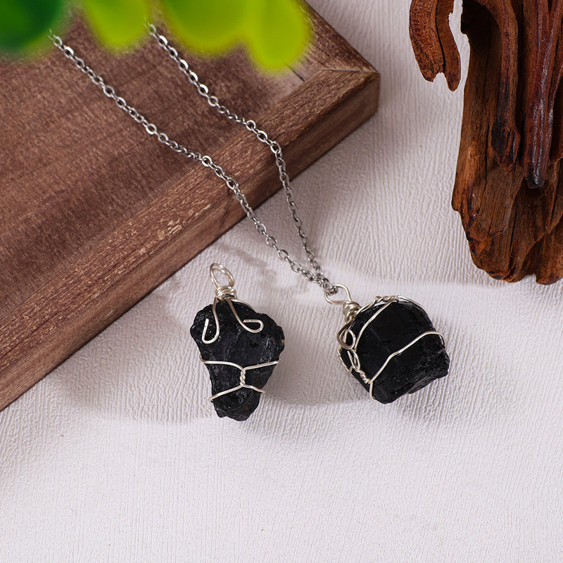 Handmade black crystal necklace with wire-wrapped raw stones, perfect for protection and spiritual healing.