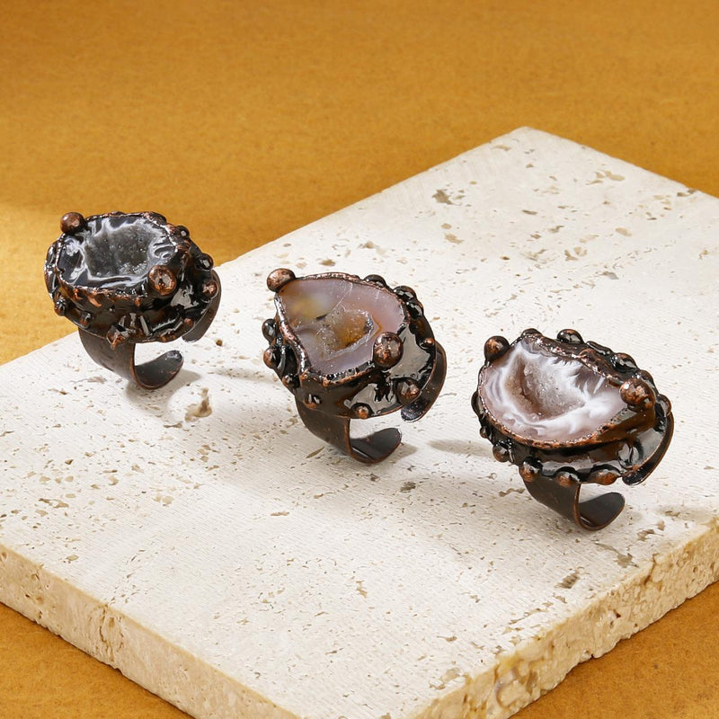 Handmade agate geode rings with rustic metal settings, natural crystal jewelry for spiritual healing and protection