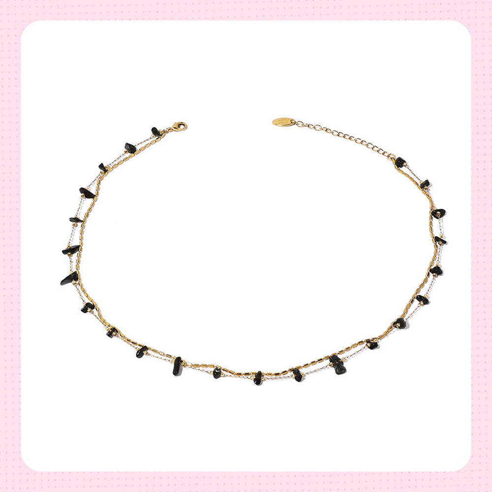 Gold chain necklace with black crystal beads, ideal for protection and spiritual energy
