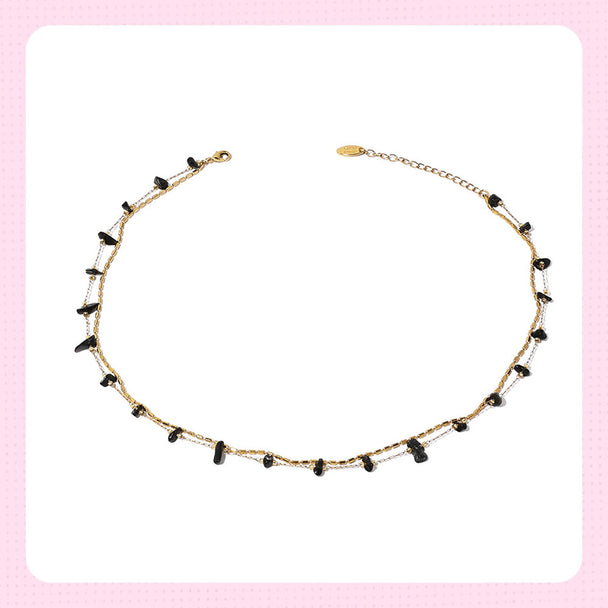 Gold chain necklace with black crystal beads, ideal for protection and spiritual energy