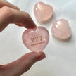 Pink heart-shaped rose quartz crystal with 777 make a wish engraving, spiritual healing stone