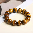Tiger eye gemstone bracelet for protection and spiritual growth, handmade with polished beads