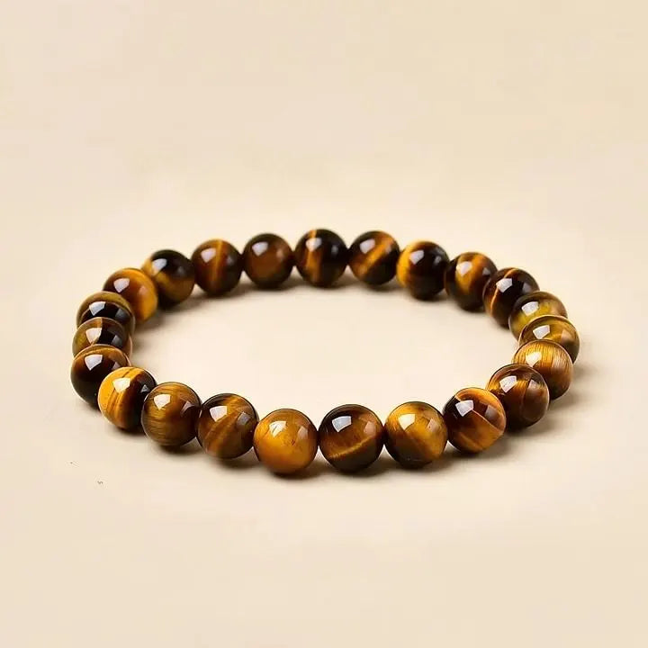 Tiger's Eye gemstone bracelet for protection and spiritual growth, handmade with polished beads