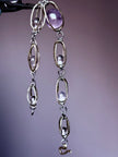 Handmade amethyst and clear crystal gemstone necklace with silver-toned chain links for spiritual healing and protection.