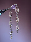 Handmade amethyst and clear crystal gemstone necklace with silver chain, perfect for spiritual healing and chakra balance.
