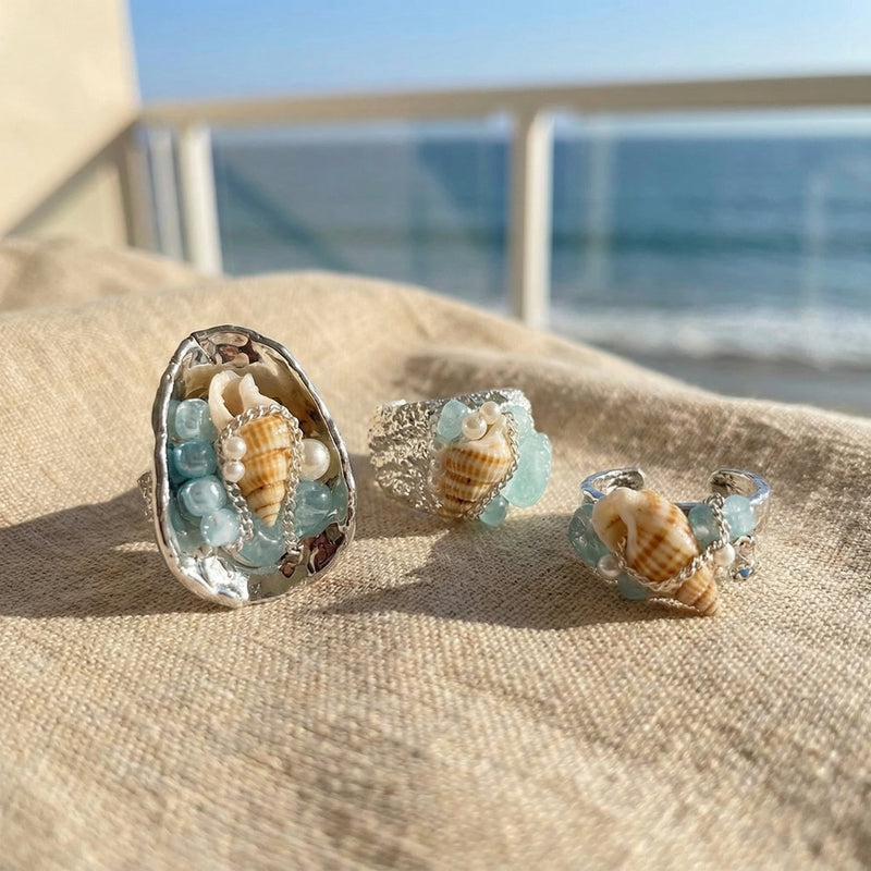 Handmade sea shell rings with aquamarine beads and pearls, beachside gemstone jewelry for spiritual calm