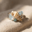 Handmade seashell ring with aquamarine gemstones and pearl, set on silver chain for spiritual jewelry lovers