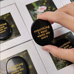 Black oval affirmation stone with gold text 'everything I want wants me more' for spiritual growth and positivity