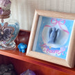 Blue angel crystal art in wooden frame with 'Dream' text, surrounded by healing stones and amethyst decor