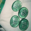 Four green healing crystals engraved with 'I am rooted But I flow' for spiritual growth and anxiety relief