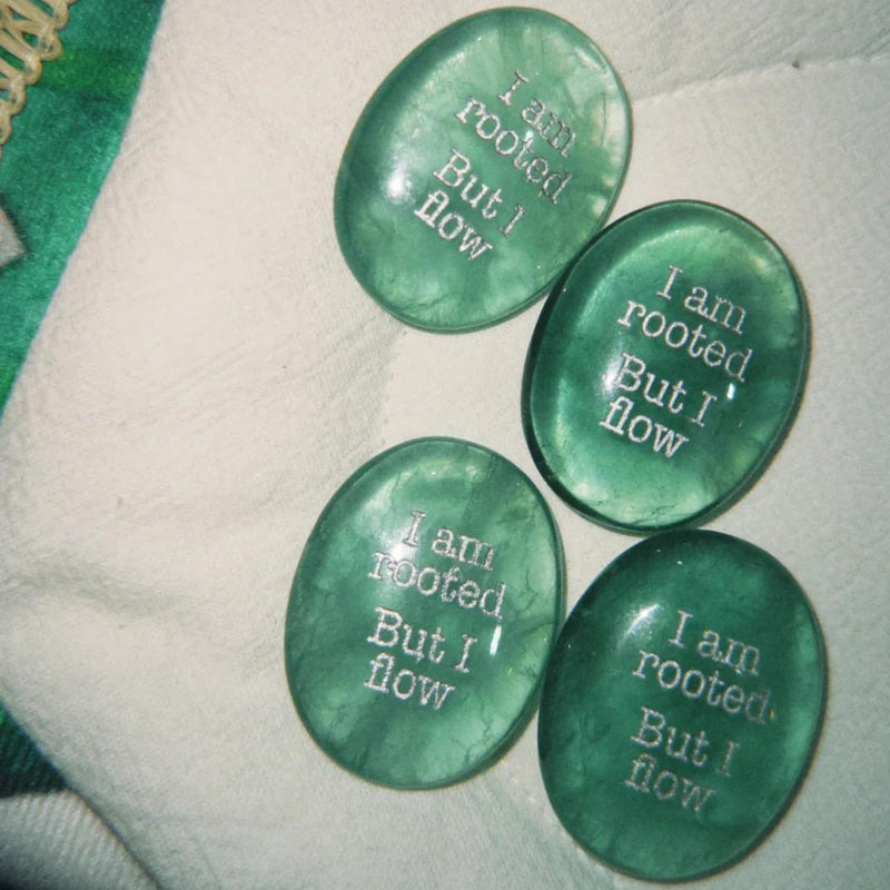 Four green healing crystals engraved with 'I am rooted But I flow' for spiritual growth and anxiety relief