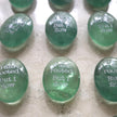 Green healing crystals engraved with 'I am rooted But I flow' for spiritual growth and anxiety relief