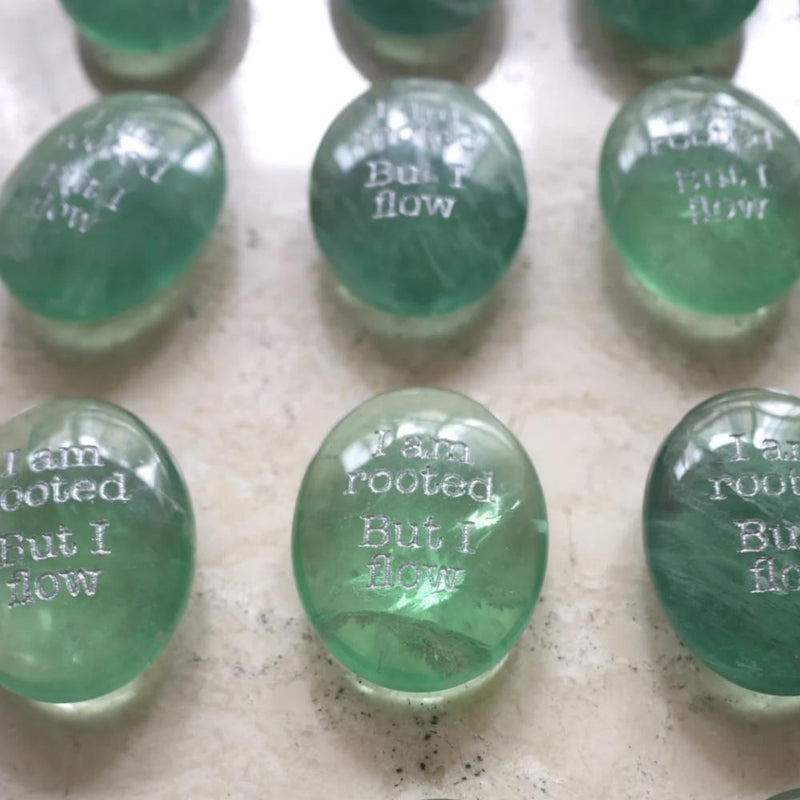 Green healing crystals engraved with 'I am rooted But I flow' for spiritual growth and anxiety relief