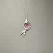 Handmade rose quartz crystal necklace in textured silver setting for love and healing energy