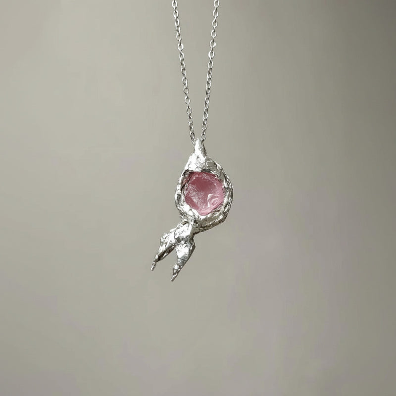 Handmade rose quartz crystal necklace in textured silver setting for love and healing energy