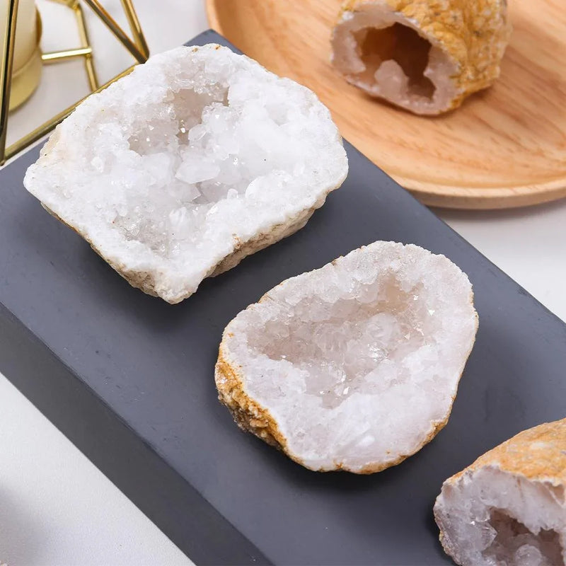 White crystal geodes with sparkling quartz interiors, ideal for healing and spiritual decor