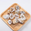 Natural geode crystal clusters on wooden tray for healing and spiritual decor