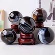 Polished agate crystal spheres on wooden stands for home decor and spiritual healing