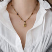Gold-toned tiger eye pendant necklace with healing crystal beads for spiritual growth and protection