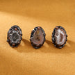Three agate geode slices with dark metallic frames, ideal for crystal healing and spiritual decor