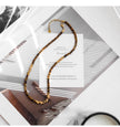 Tiger eye gemstone necklace with gold beads, healing crystal jewelry for spiritual growth and protection