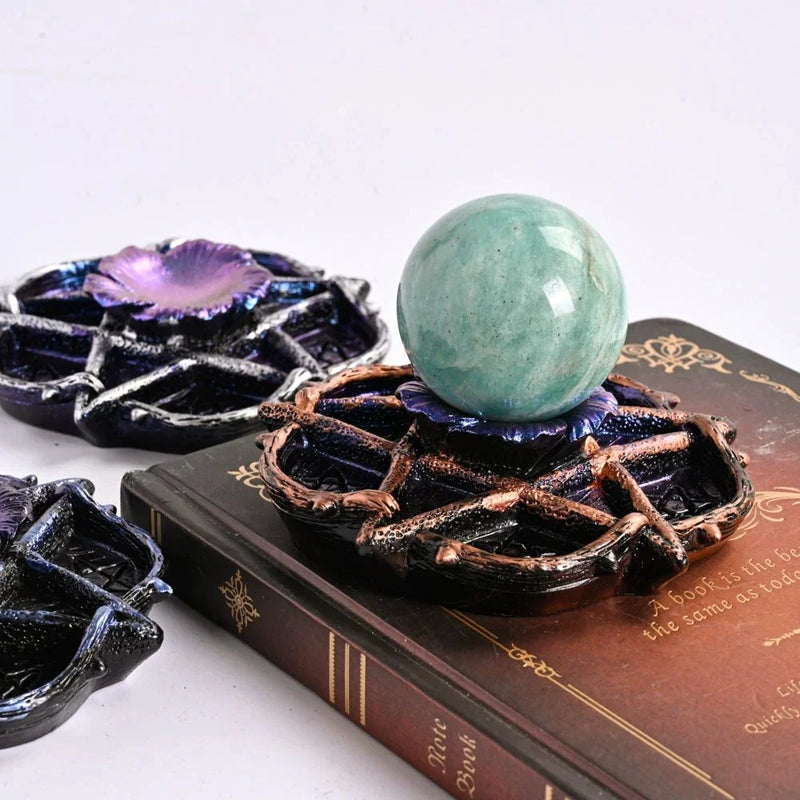 Green aventurine crystal sphere on ornate purple lotus stand, ideal for chakra healing and spiritual decor