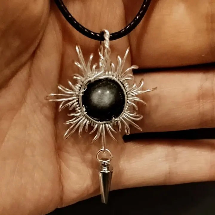 Black tourmaline sunburst pendant with silver wire wrap and dowsing pendulum for protection and grounding