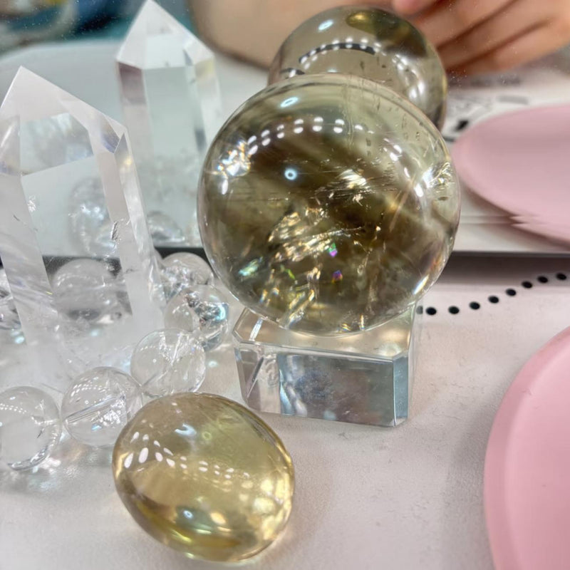Clear quartz crystal spheres and points for spiritual healing and chakra balancing