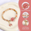 Handmade cat paw crystal bracelet with golden accents and healing gemstones for spiritual growth