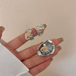 Handmade seashell and pearl rings with aqua gemstones, ocean-inspired jewelry for spiritual healing and protection