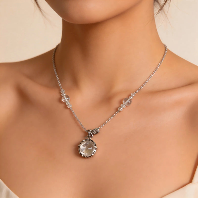 Clear quartz crystal necklace with silver chain and dragonfly charm, handmade gemstone jewelry for spiritual healing
