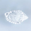 White howlite bead bracelet on crystal point, promoting calm and spiritual growth