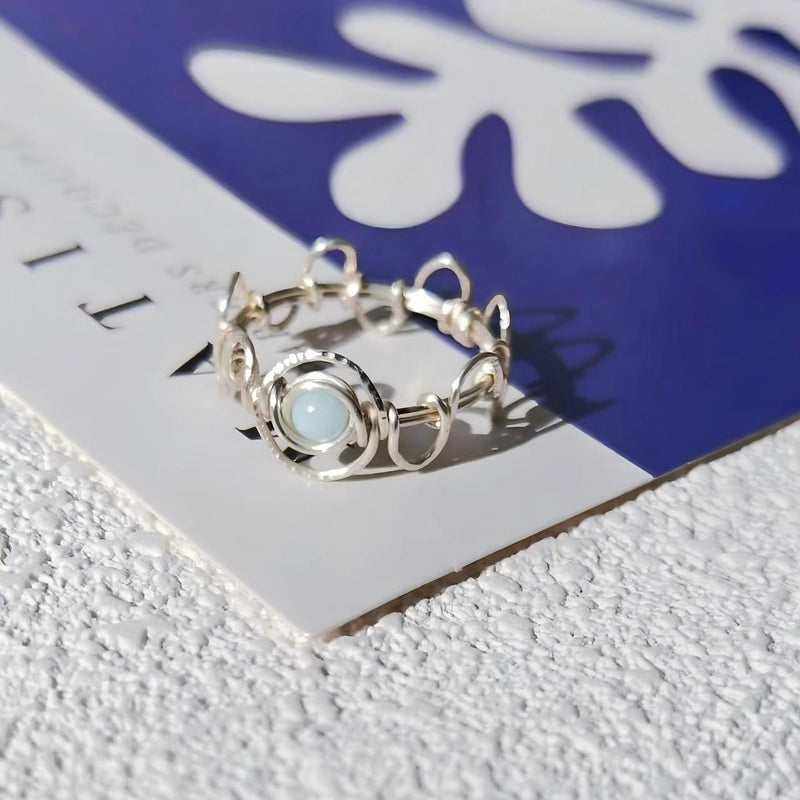 Handmade silver ring with light blue crystal, perfect for healing and spiritual growth