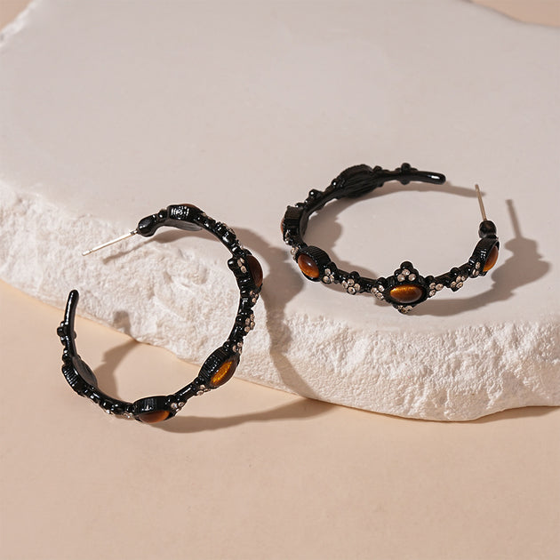 Black hoop earrings with tiger eye stones and crystal accents, handmade gemstone jewelry for spiritual healing.