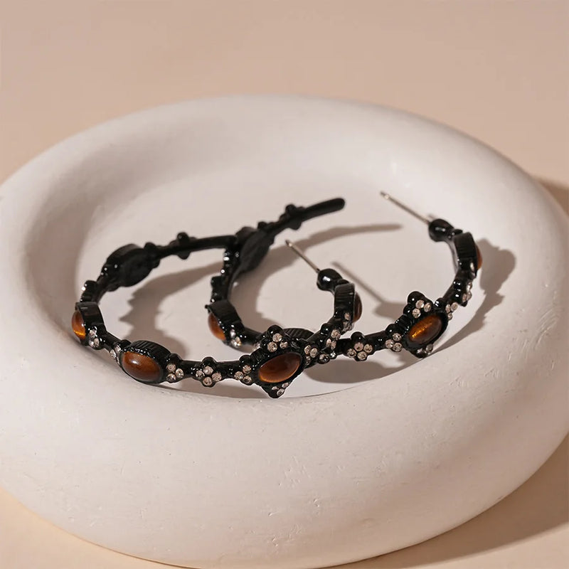 Black hoop earrings with tiger eye stones and crystal accents, spiritual jewelry for protection and healing
