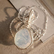 Handmade moonstone pendant with silver wire wrapping, healing crystal jewelry for spiritual growth and protection