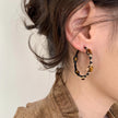 Tiger eye gemstone hoop earrings with gold accents, healing crystal jewelry for spiritual energy and protection