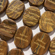 Tiger eye healing crystals engraved with 'Solvitur ambulando' for spiritual growth and anxiety relief